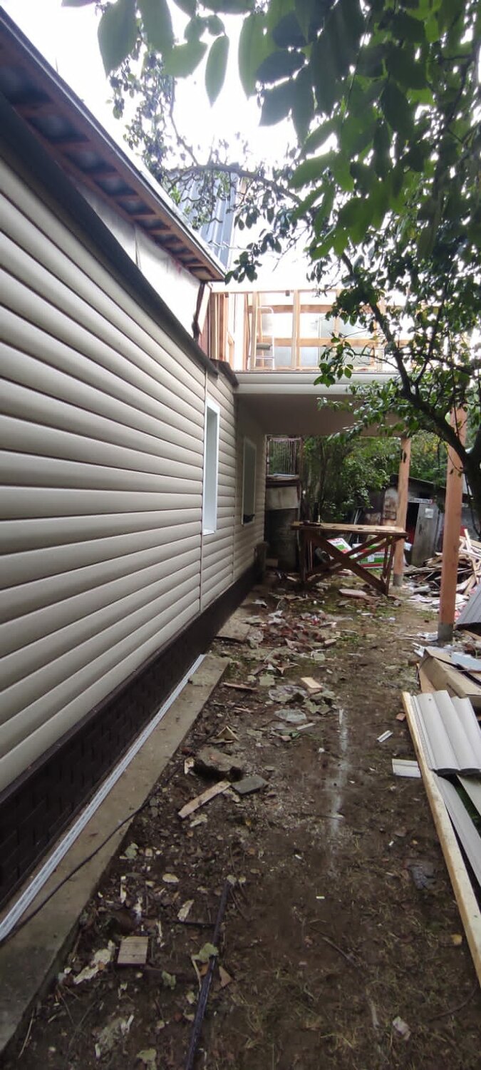 Монтаж фасада из винилового сайдинга