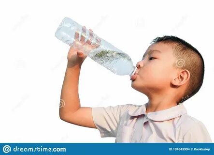 Photo about Happy Asian child student boy drinking some water by a plastic ...