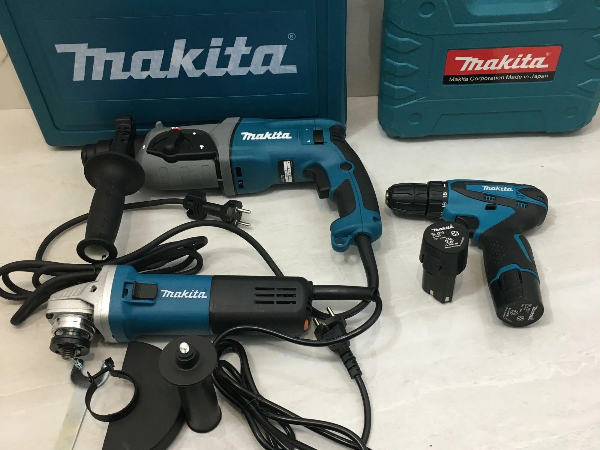 Набор перфоратор болгарка. Перфоратор+шуруповерт+болгарка Makita. Набор Makita болтоверт шуруповерт перфоратор 128. Болгарка шуруповерт перфоратор фирмы Макита. Шуруповерт болгарка гайковерт перфоратор Makita набор.