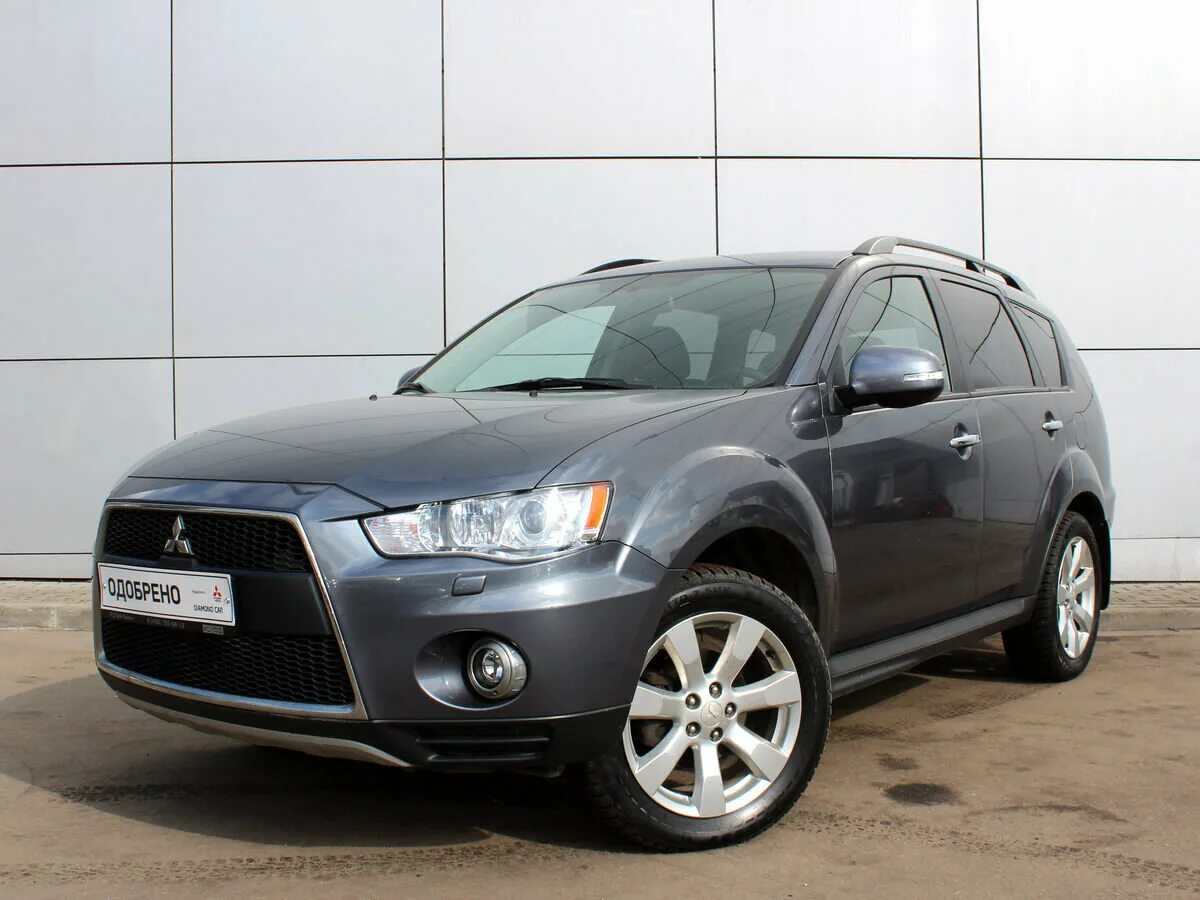 Мицубиси минусы. Mitsubishi Outlander XL 2011. Аутлендер XL 2012. Митсубиси Аутлендер ХЛ 2012. Mitsubishi Outlander XL 2012 черный.