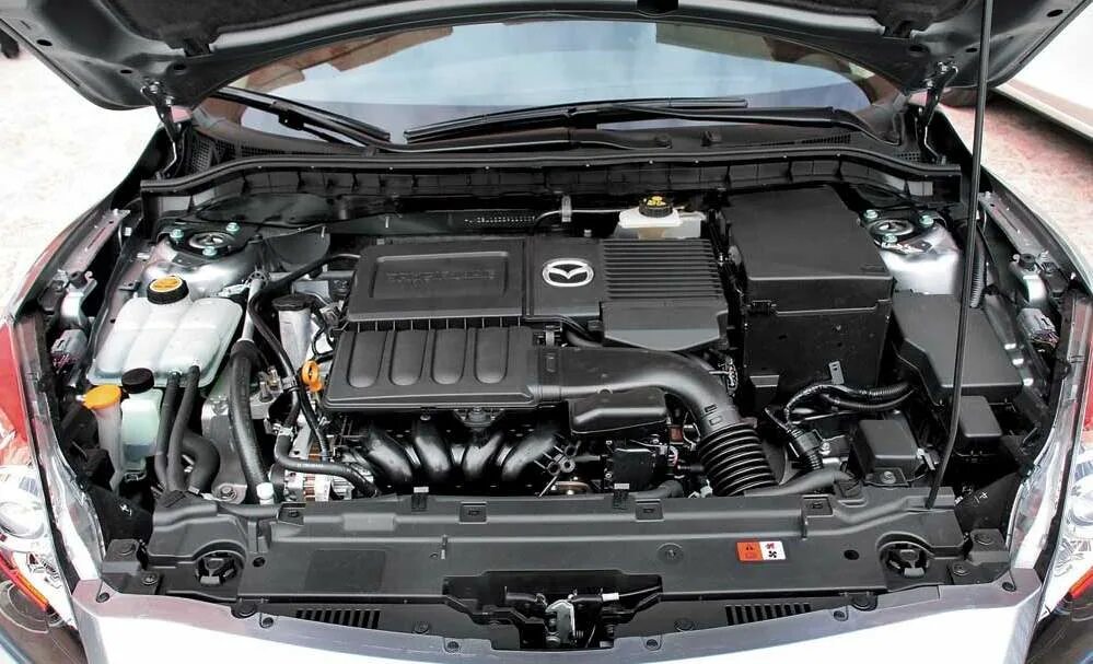 1.3 литра двигатель. Мазда 6 2006 2.3 аккумулятор. Мазда 3 1.6 2010 аккумулятор. Mazda 3 BK 1.6 подкапотное. Mazda 3 1.6 2008 подкапотка.