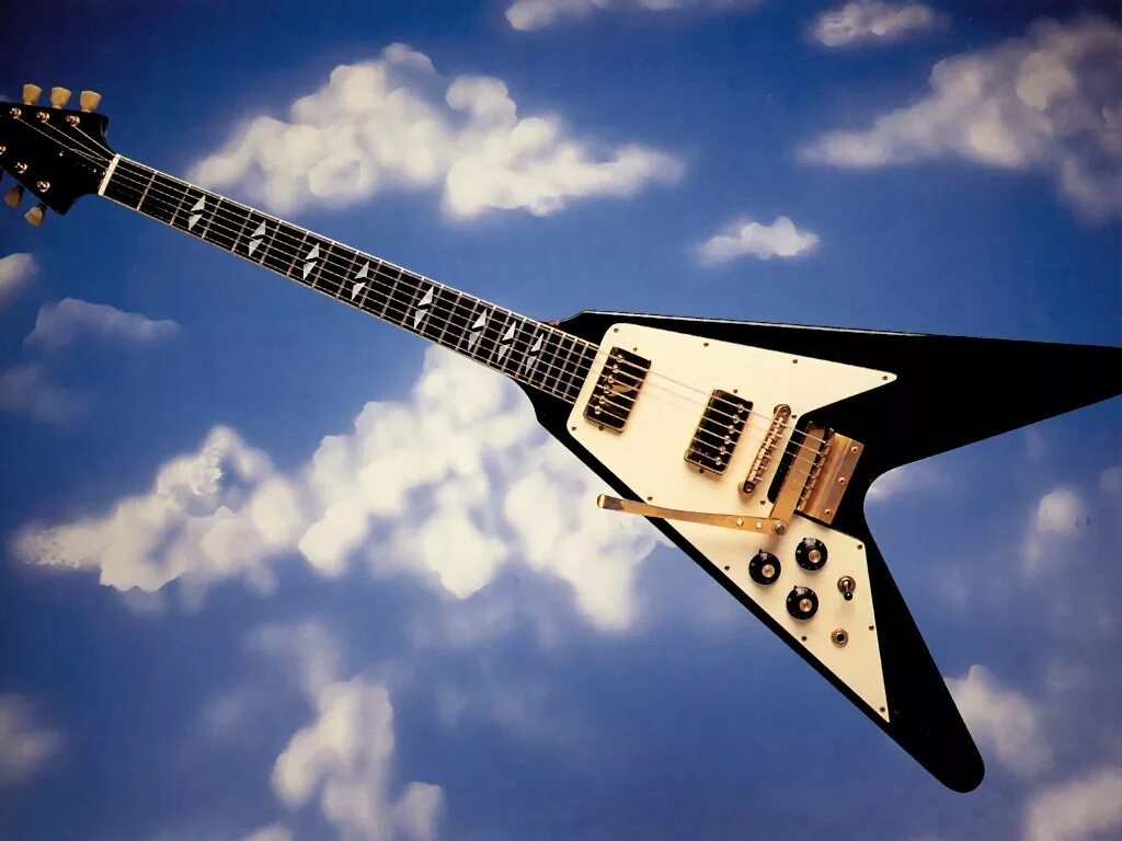 Гитара fly. Gibson Flying v Jimi Hendrix. Летающая гитара. Обои на рабочий стол электрогитара. Гитара классическая Flying v.