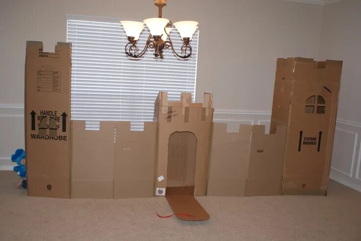 Cardboard box castle. Twine for ladders & working drawbridge. There's 2 windows