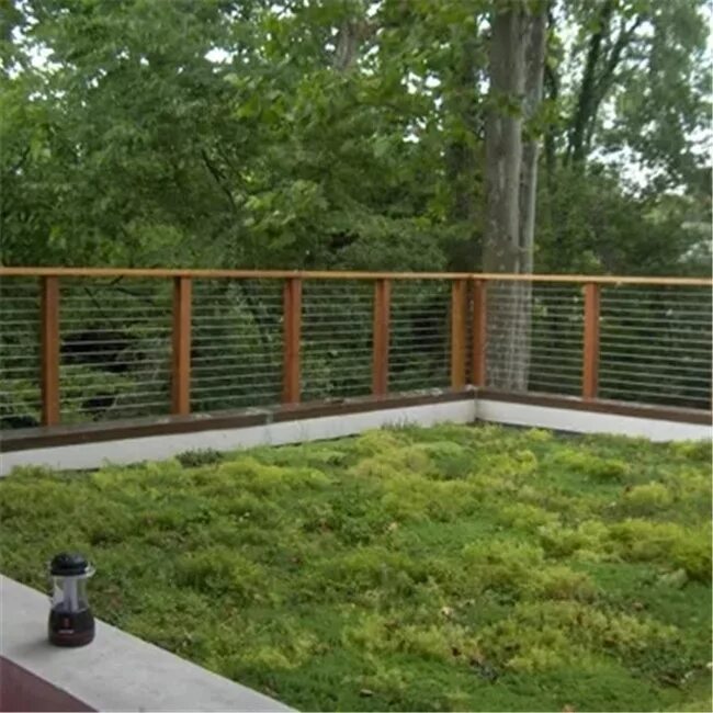 This sweet front yard is really made by the beautiful timber fence with stone pa