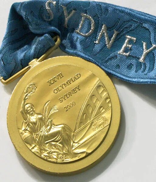 медали олимпийских игр 2000. олимпийские медали из чего. сидней 2000 олимпиада медаль. олимпийские медали сидней 2000.