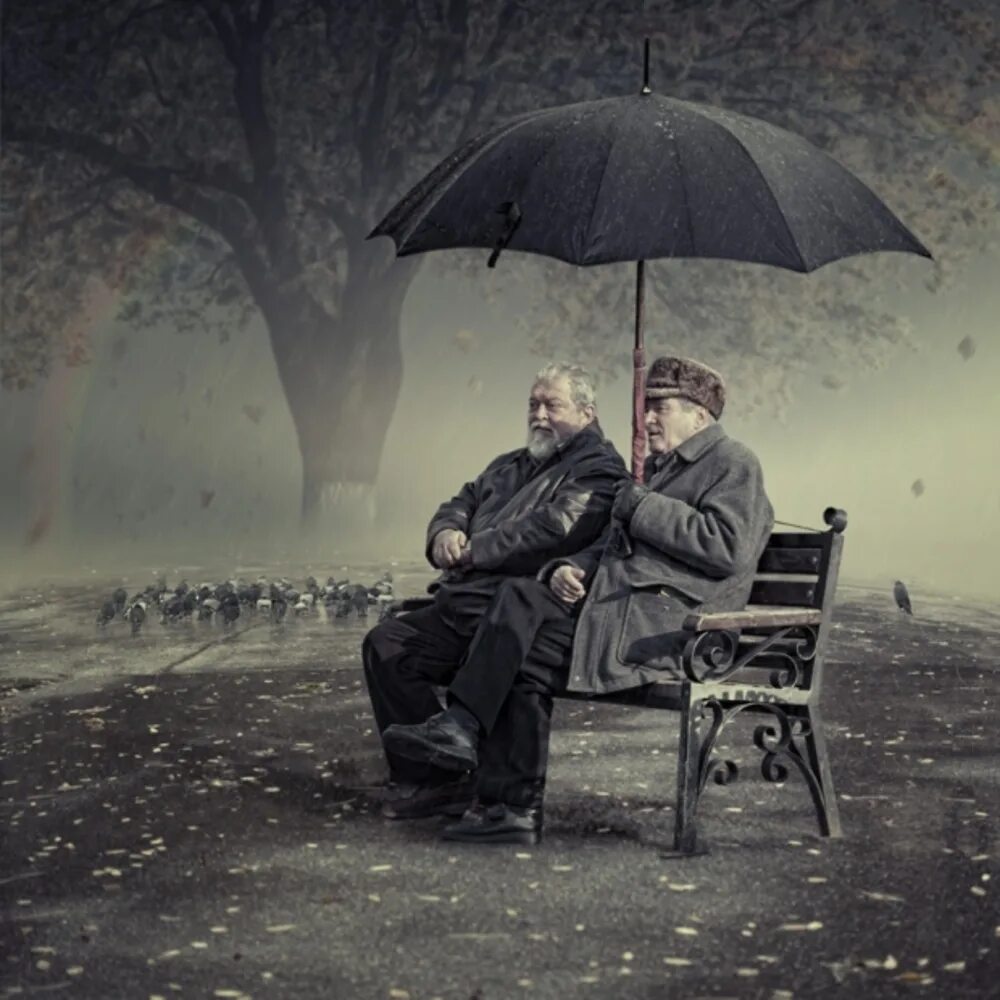 Зонтик сидит. Человек под зонтом. Фотосессия с зонтиком. На скамейке под зонтом. Парень на скамейке под дождем.