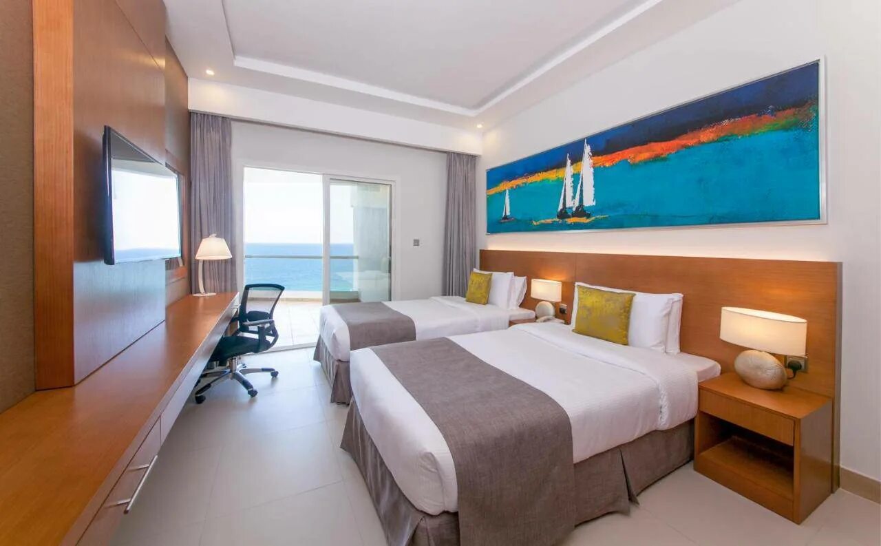 Ramada by wyndham ajman. Отель ramada by wyndham beach hotel ajman. ramada beach hotel ajman 4 аджман. отель by wyndham ramada в аджмане. рамада бай виндхам бич отель аджман.