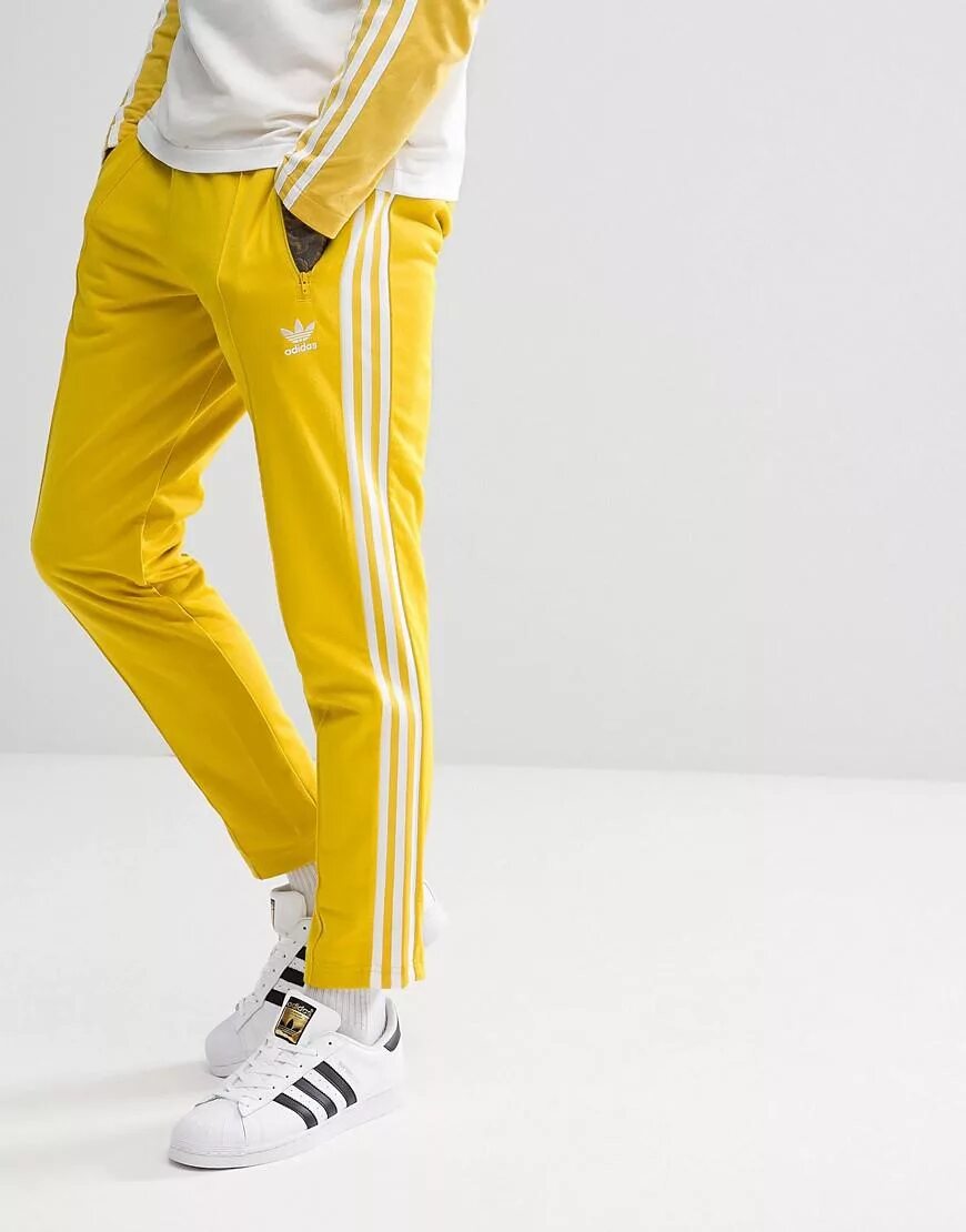 Брюки adicolor Beckenbauer. Adidas Originals Beckenbauer штаны. Джоггеры адидас желтые. Adidas Originals adicolor штаны.