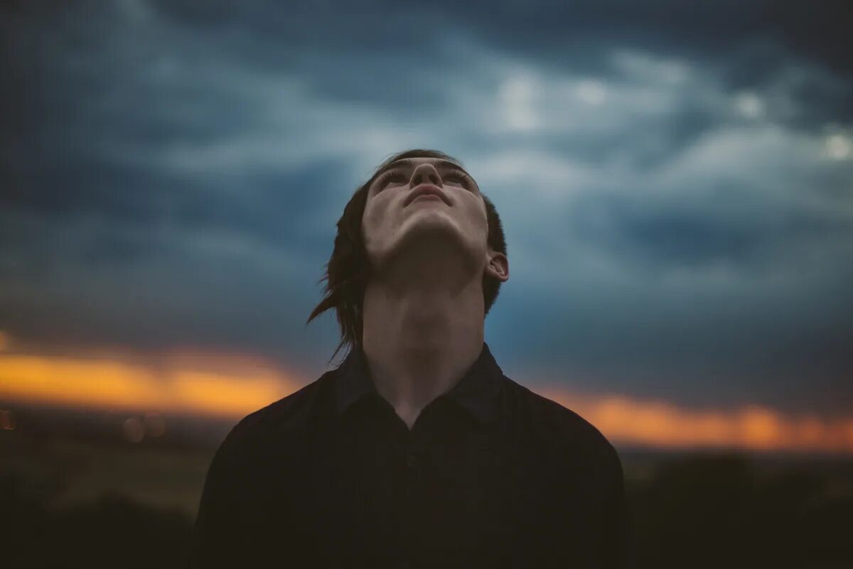 Sky look at me. Person looking up. man looking up. looking to the sky. look up to the sky.