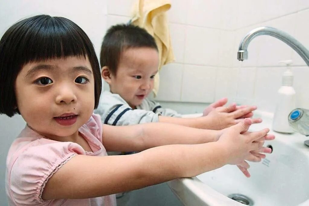 The children have washed. Children Wash. Asian child Washes.