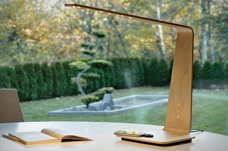 The lamp is on the desk