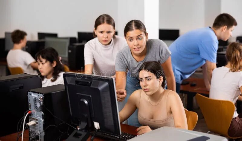 Teacher check on. Teenager with Computer. Studying on the Computer.