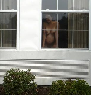 Slideshow spying on nude neighbor.