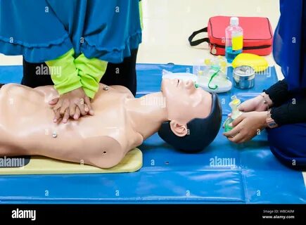 Heart pump with medical dummy on CPR, in emergency refresher training to as...