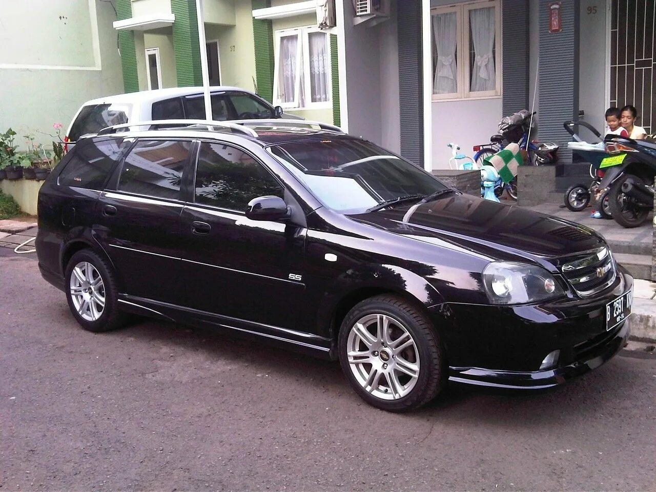 Тюнинг лачетти универсал. Chevrolet Lacetti универсал Tuning. Chevrolet Lacetti 2006 Tuning. Chevrolet Lacetti SW черный. Lacetti SW обвес.