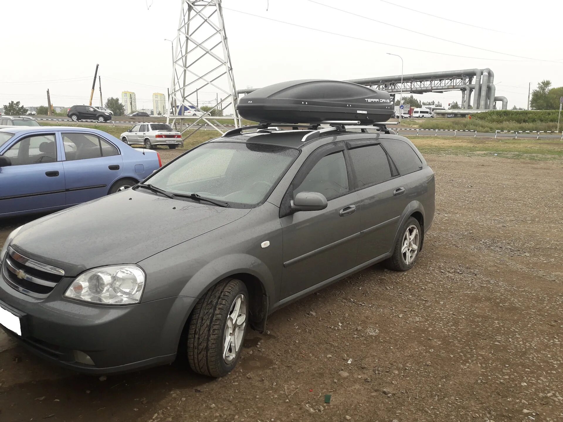 Купить багажник шевроле лачетти. Chevrolet Lacetti универсал багажник. Автобокс Chevrolet Lacetti универсал. Багажник Thule Chevrolet Lacetti 2010. Рейлинги на Шевроле Лачетти.