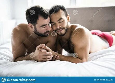 A Handsome Gay Men Couple on Bed Together Stock Image - Image of bedroom, mexica