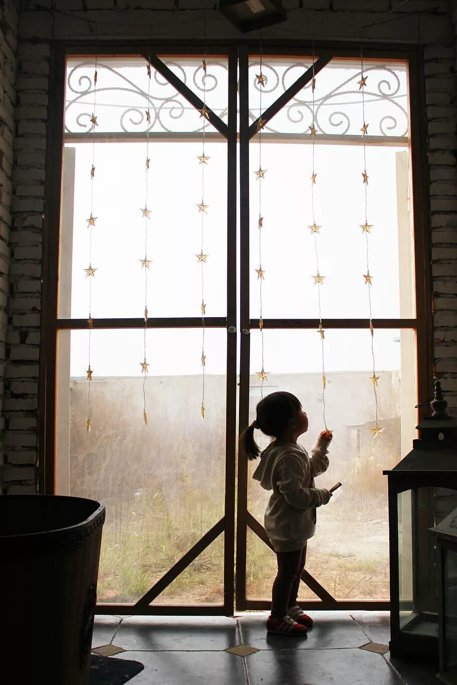 Sam is by the window