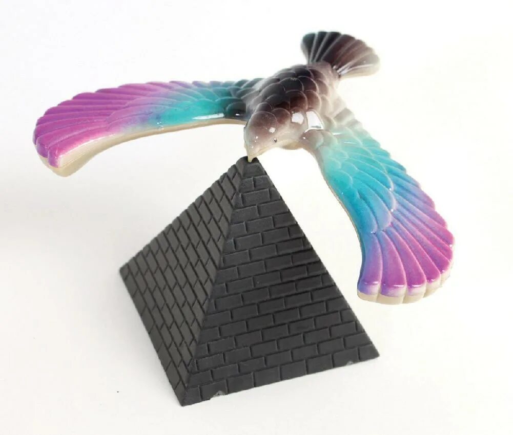 Сколько стоит птичка. Птица на пирамиде игрушка. Игрушка балансирующая птица. Птичка балансирует игрушка. Птица балансирующая на клюве.