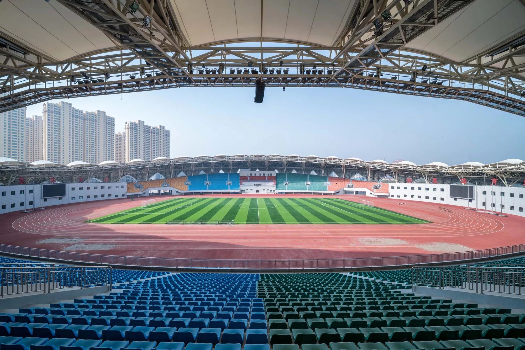 Huangpu Sports Center Stadium. Suzhou Olympic Sports Centre Stadium. Стадион олимпийского спорткомплекса города Циньхуандао. Ордос Стэдиум Китай.