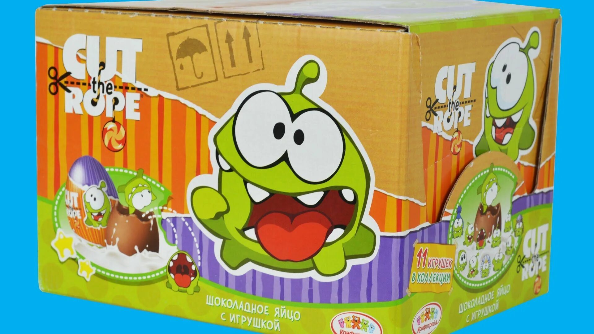 Включи киндер ам нямов. Cut the Rope игрушки. Ам Ням коробка. Om nom Cut the Rope игрушки. Киндер сюрприз с ам Нямом.