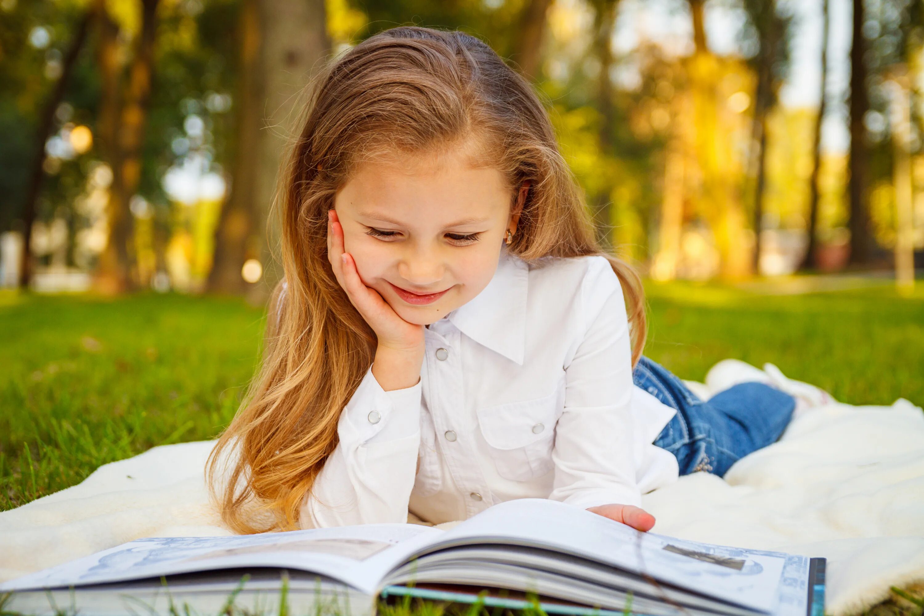 The girl is reading the book