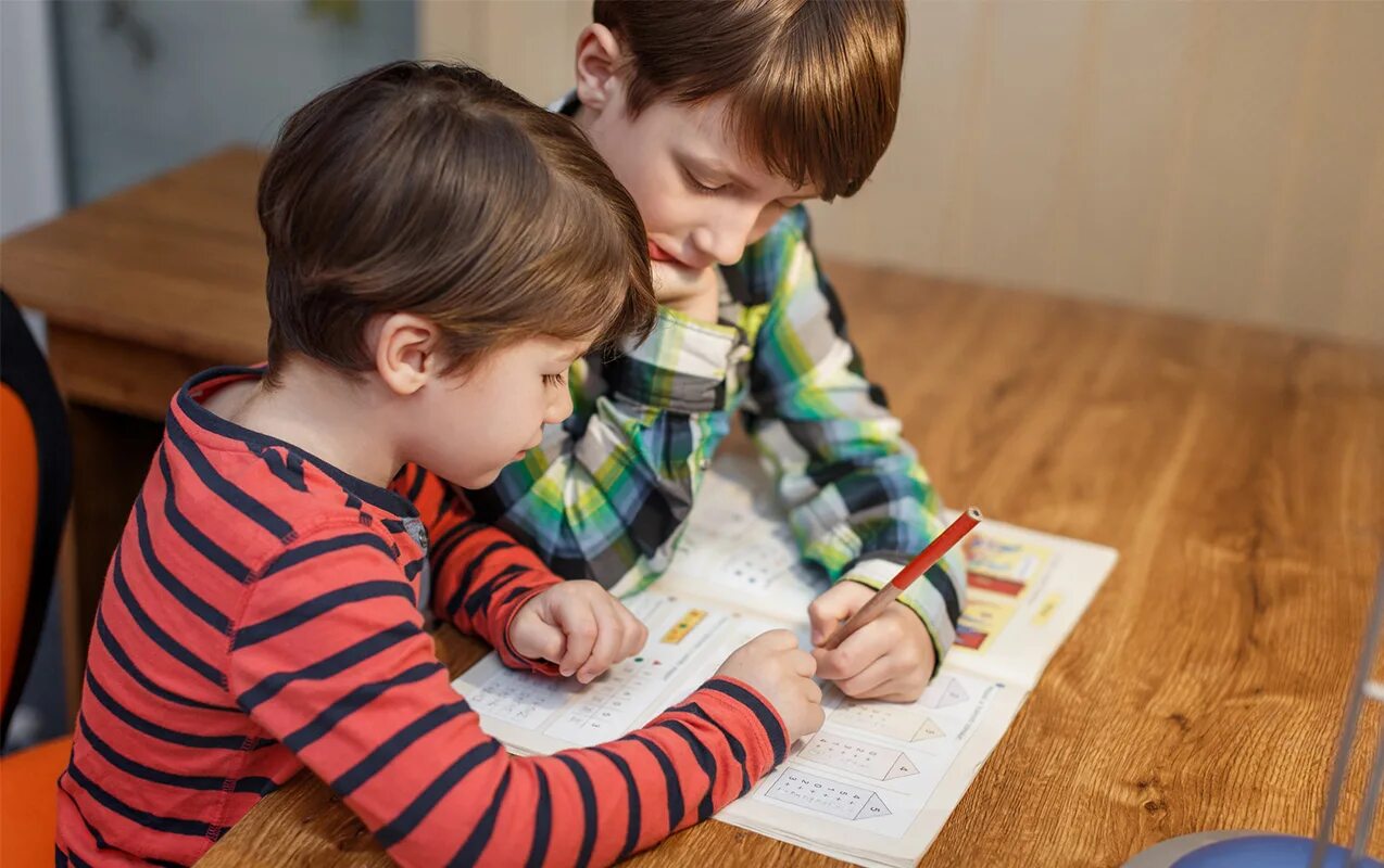 Two boys doing homework.