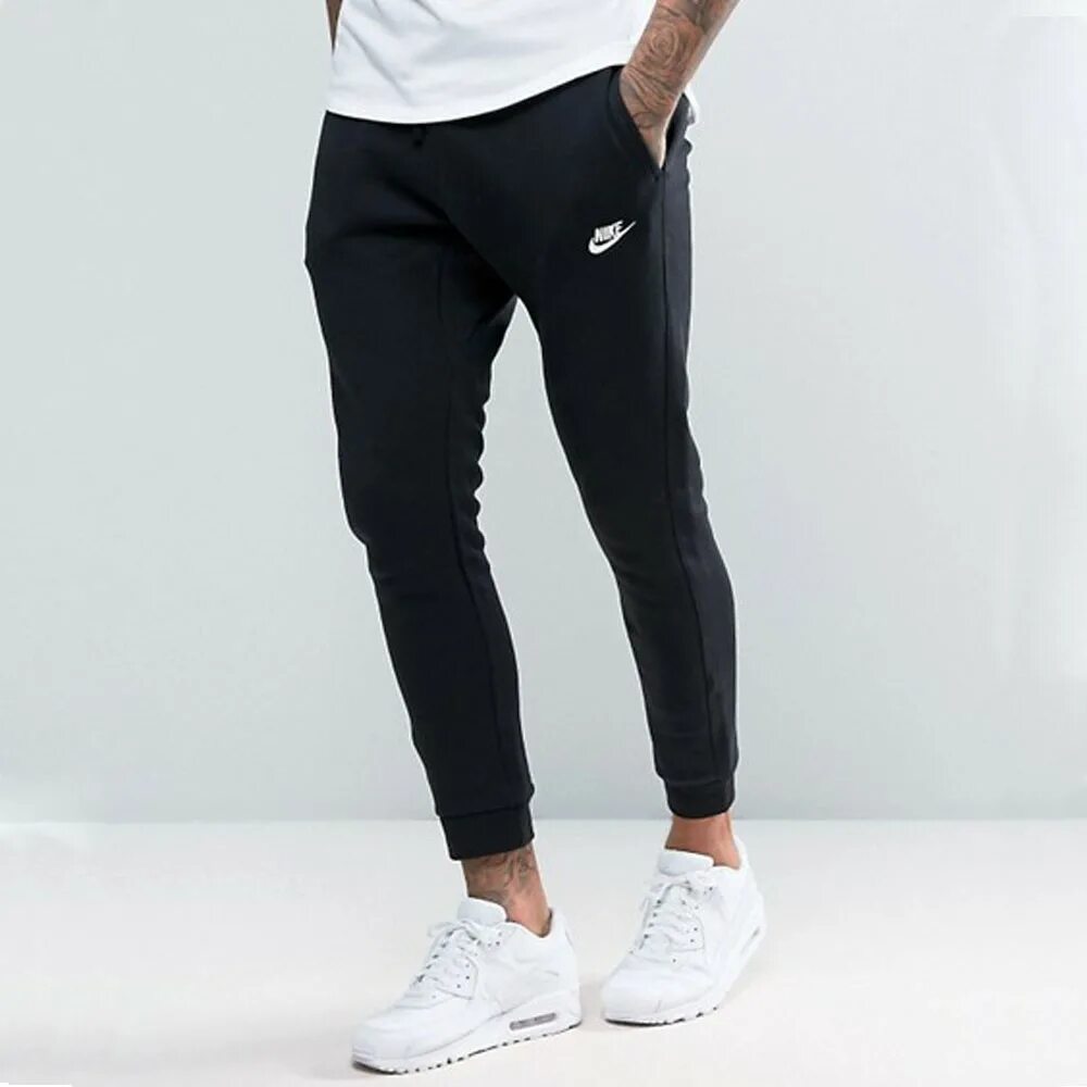 Черные штаны найк. Nike Club Cuffed Joggers in Black. Джоггеры найк мужские. Штаны Nike 2023. Штаны найк джоггеры.