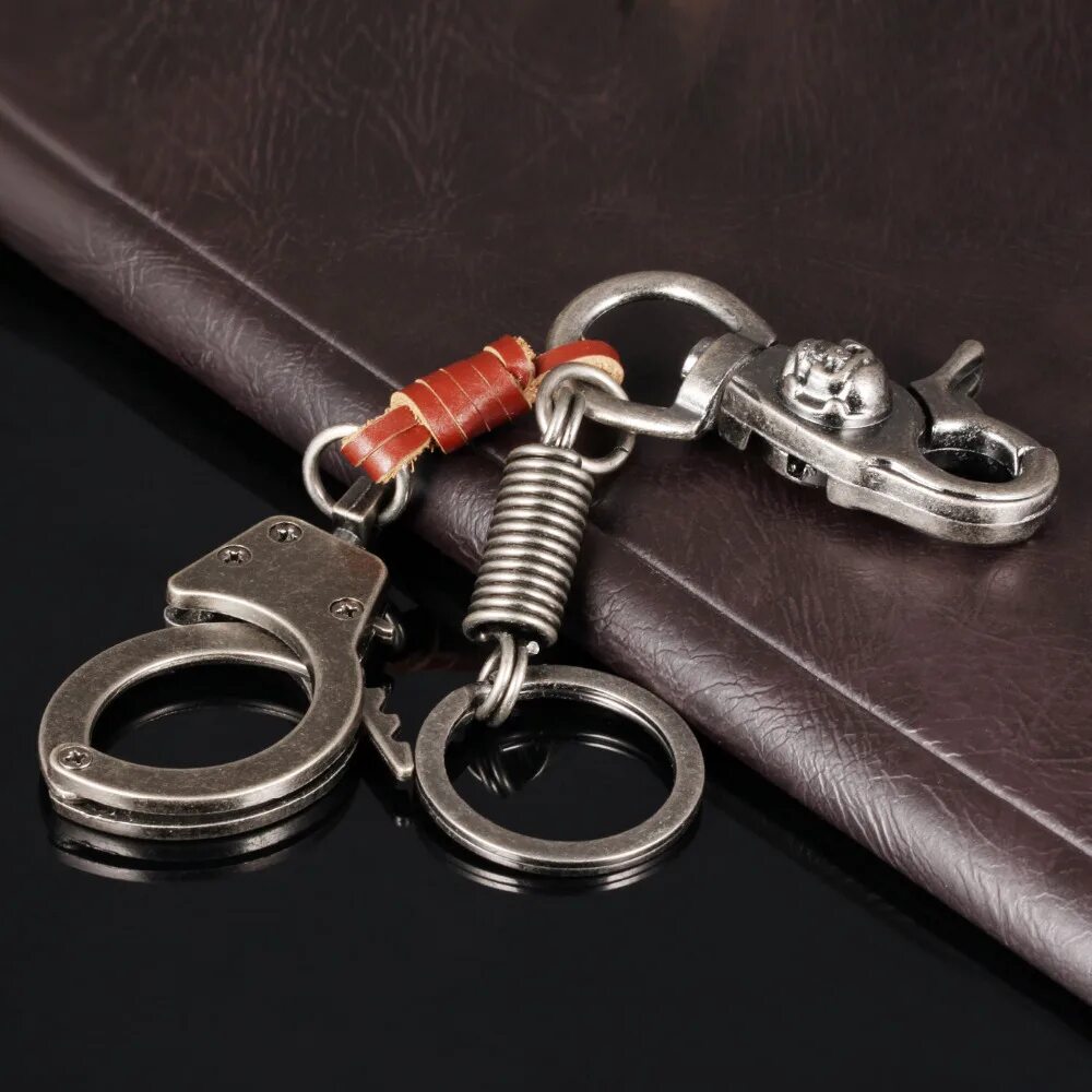 Наручники без ключа. Брелок «наручники». Брелок наручники для ключей. Пластиковые наручники с ключом.
