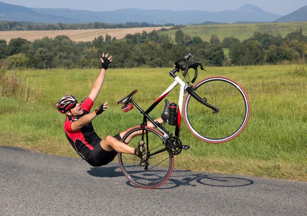 Off his bike. Человек на велосипеде. Велосипед с приподнятым.