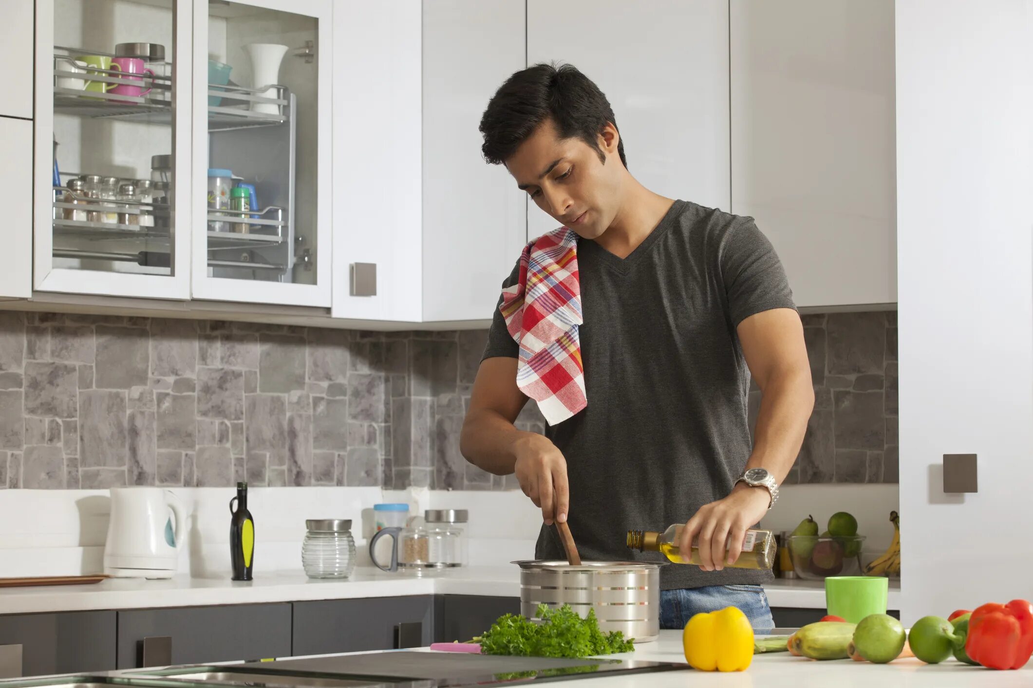 Man in Kitchen. Food in the Kitchen. Men do housework. She to help many times