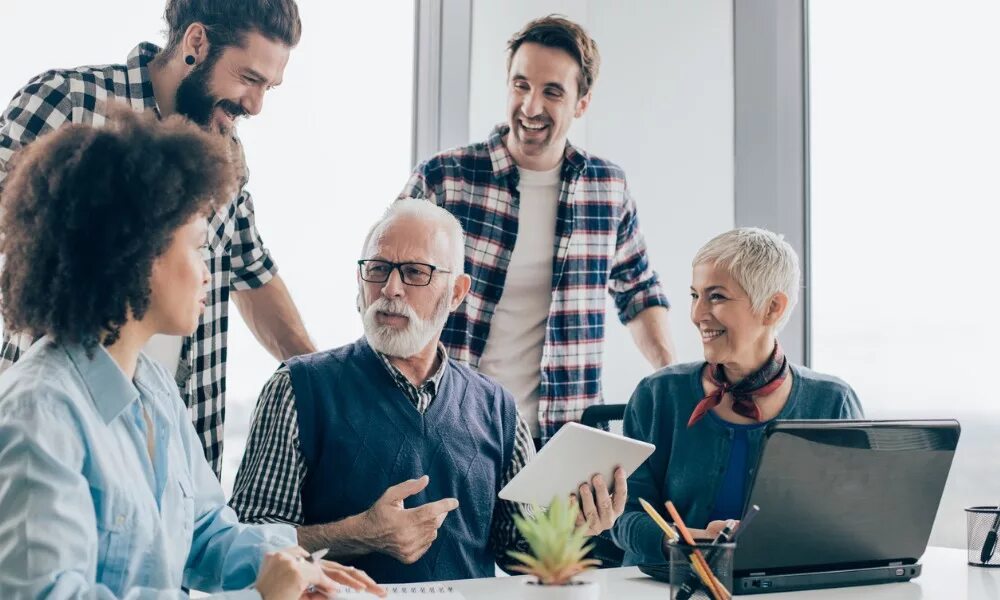 Ageing society. Consider old age. Older workers sharing experience. Pictures about Generations in the workforce. Man stuff coworkers.