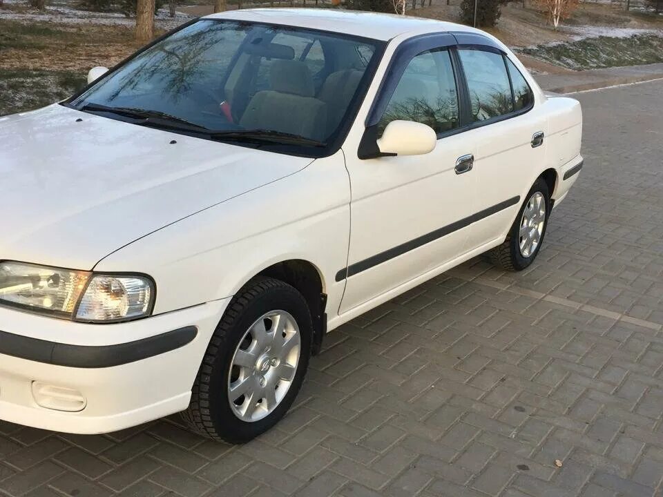 Ниссан санни годы выпуска. Ниссан Санни b15. Ниссан Санни 2001 белый. Ниссан Санни белый 2003. Nissan Sunny b15 2003.