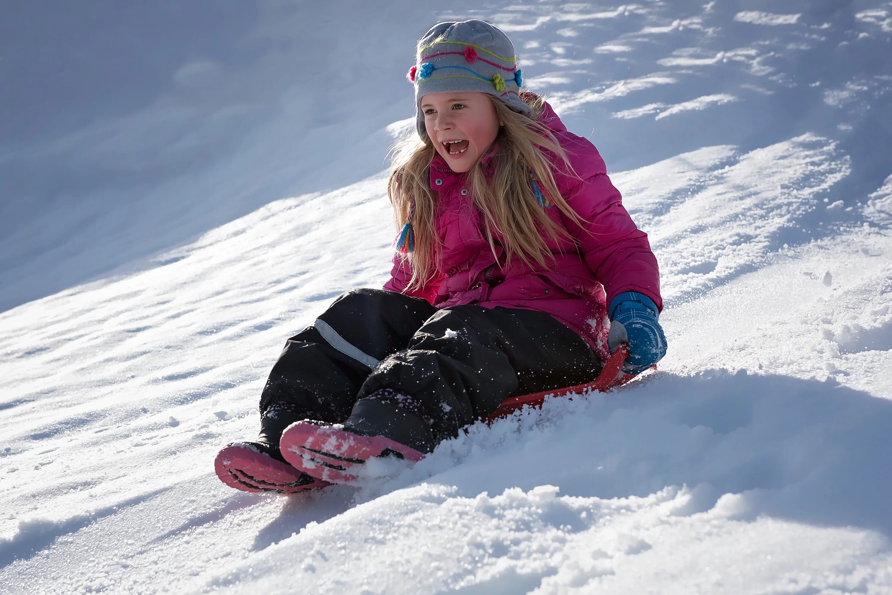 Child playing in the snow