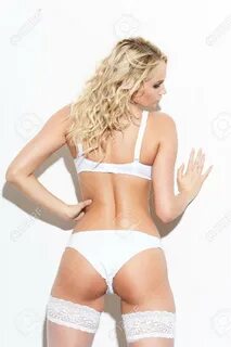 Sexy Blonde Woman In White Underwear Posing At Wall Stock Photo, Picture An...