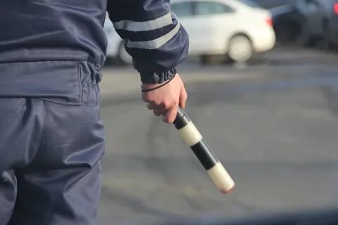 Мужчина с жезлом