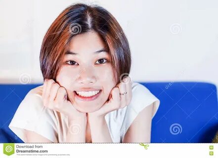 Cute Short Hair Asian Teenagers Smiling At You. 