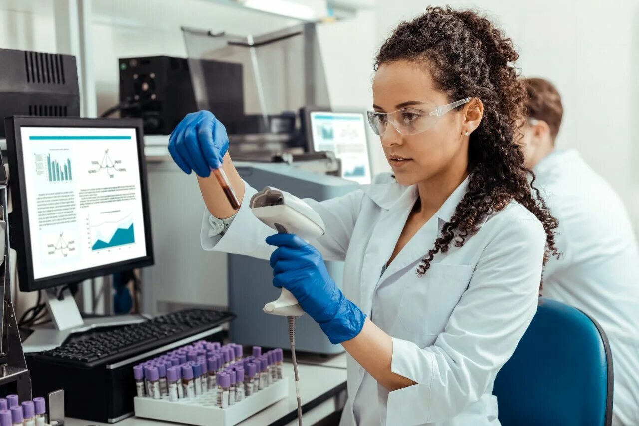 Ladies lab. Woman lab technician protective glasses. ай би транслейшнз юристы.