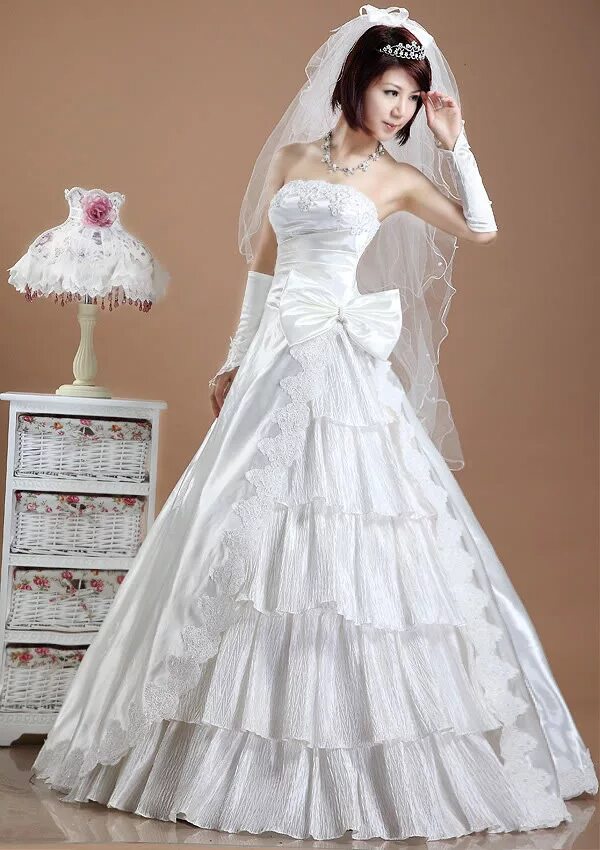 Производитель свадебных платьев. Свадебное платье с бантом. Кремовое свадебное платье. Свадебное платье с бантиком. Китайское свадебное платье.