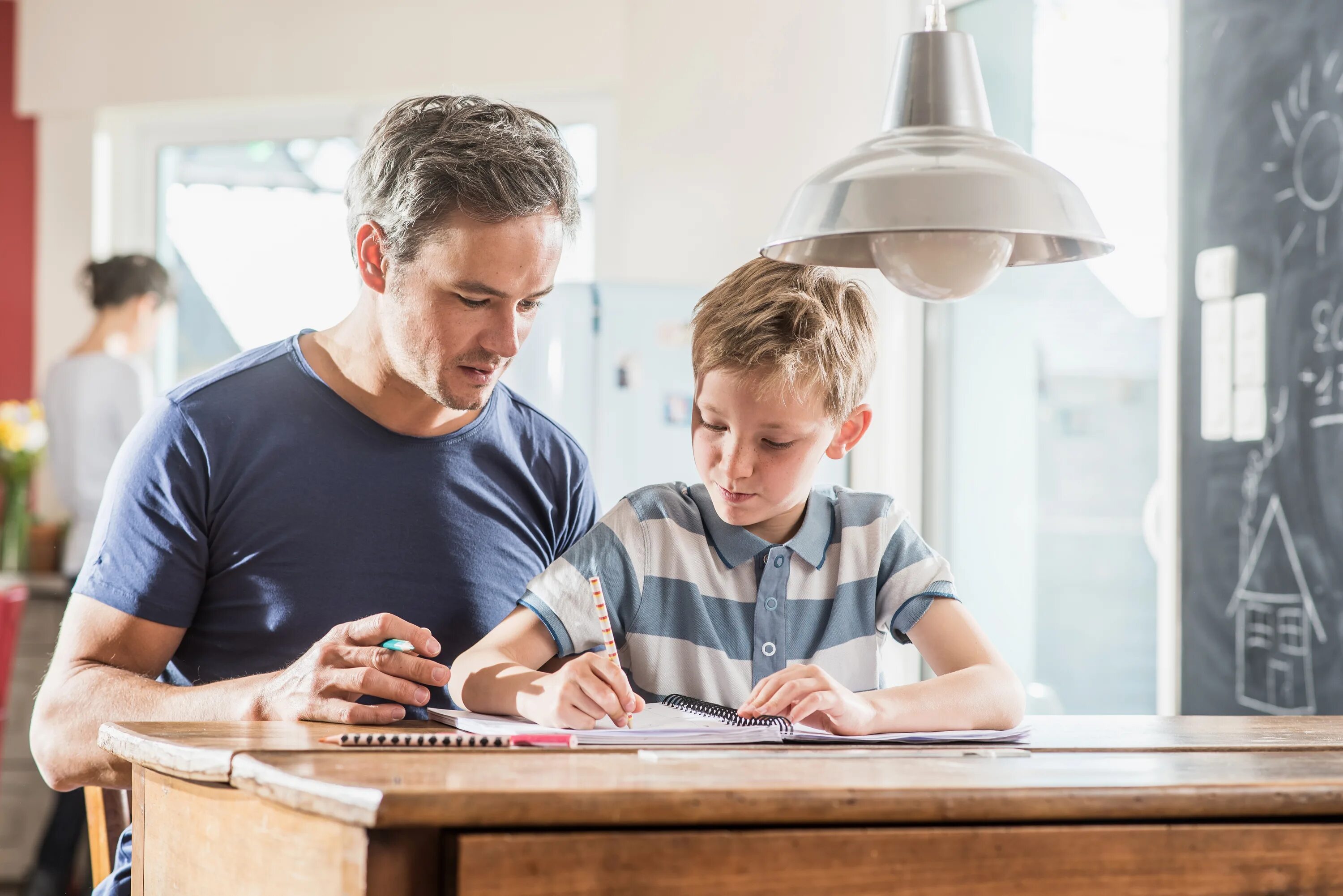 What s dad doing. Children and father do homework. Father and son Math Lessons. The boy does his homework carefully. The thinking child.