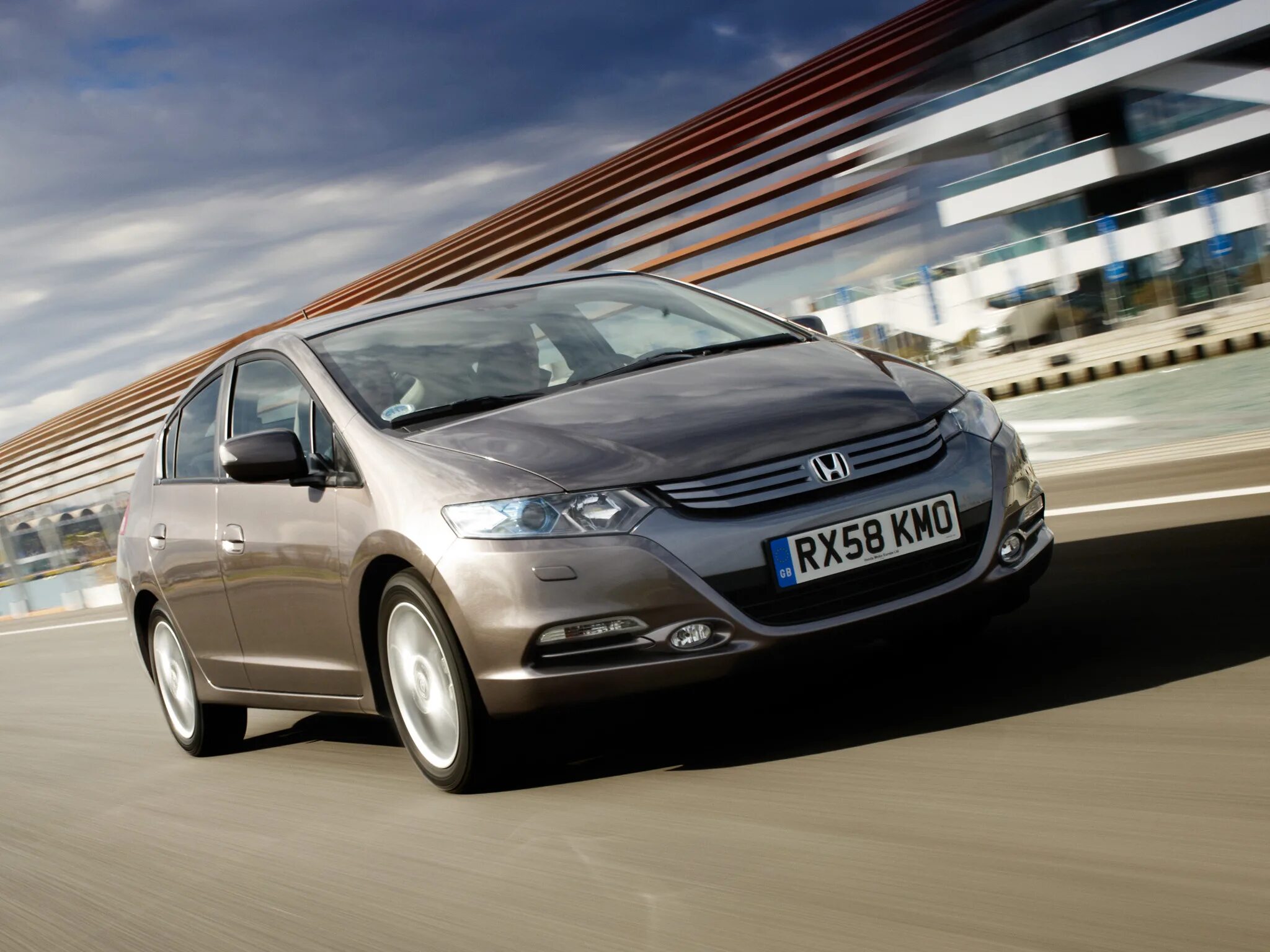 Инсайт 1. Honda Insight ze2. Honda Insight 2 поколение. Honda Insight 2009. Хонда Инсайт 2011.