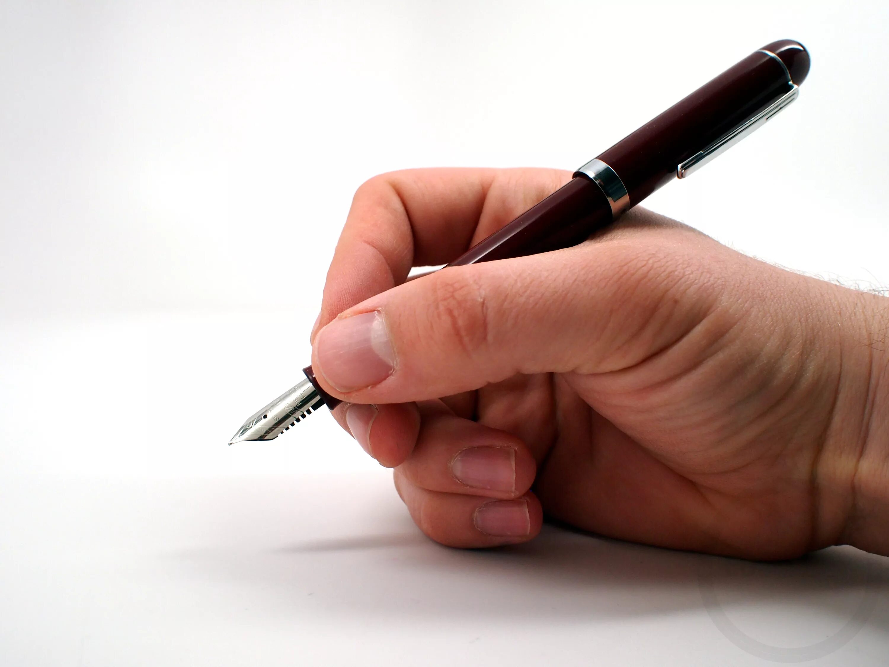 Hand with Pen. Writing Pen. Hand Ballpoint Pen. Hand with Pen writing. Written with a pen