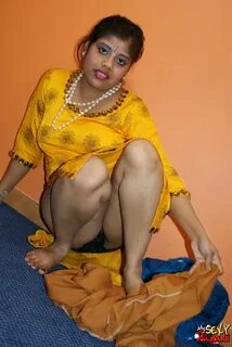 Horny looking rupali bhabhi in yellow shalwar suit looking hot.