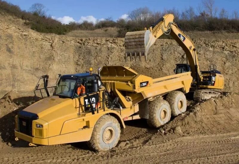 Материалы экскаватора. Строительная техника Катерпиллер. Caterpillar 740. Caterpillar 740 Ejector. Спецтехники Caterpillar.