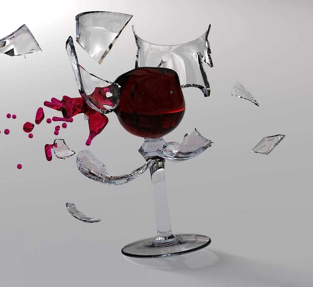 Разбитый бокал с вином в руках. Битый бокал от вина.
