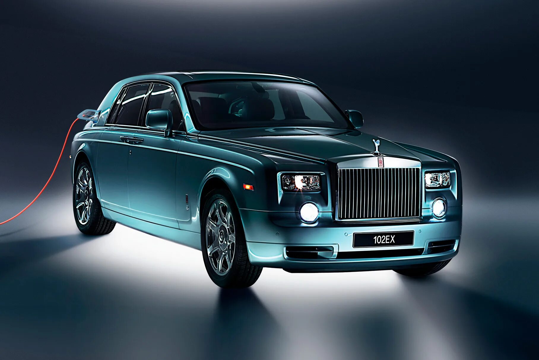 Роллс ройс название. Rolls-royce phantom 102ex. роллс ройс фантом 2011. роллс ройс электромобиль 2025. роллс ройс электромобиль концепт.
