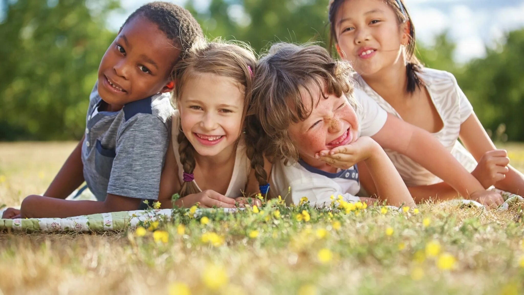And which child is this. Дети в солнечных очках на траве. elders and kids. ethnicity. invisalign kids.
