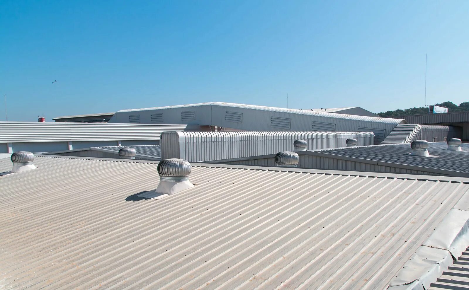 It has a roof. Commercial roofing. commercial roofing services. commercial cleaning systems on roof. company with roof.