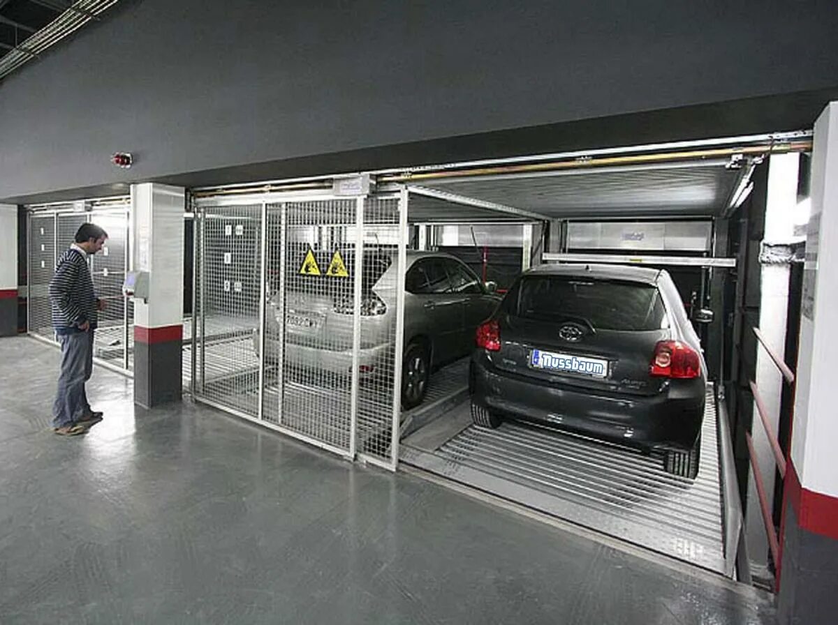 Росреестр машиноместо. Система Nussbaum parking. Ограждение машиноместа в подземном паркинге. Шкаф в подземный паркинг. Бокс для подземной парковки.