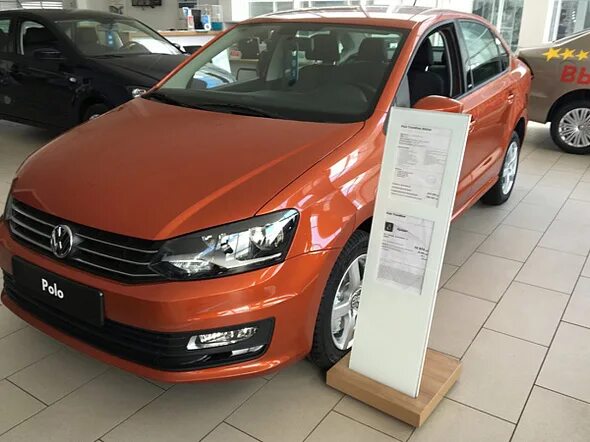 Купить фольксваген поло дилер. Фольксваген поло седан оранжевый. VW Polo sedan Рестайлинг оранжевый. Фольксваген поло 2016г оранжевый. Фольксваген поло седан Рестайлинг оранжевый.